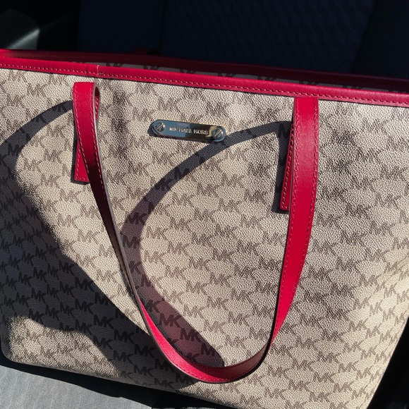 Michael Kors tote 19 length 11 wide zippered closures outside and out. 3 inside - Picture 2 of 11